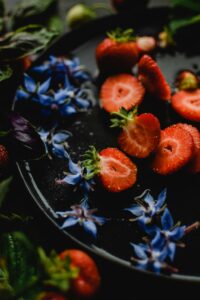 edible borage flowers and strawberries