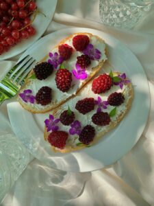 edible flower and berries on toast 