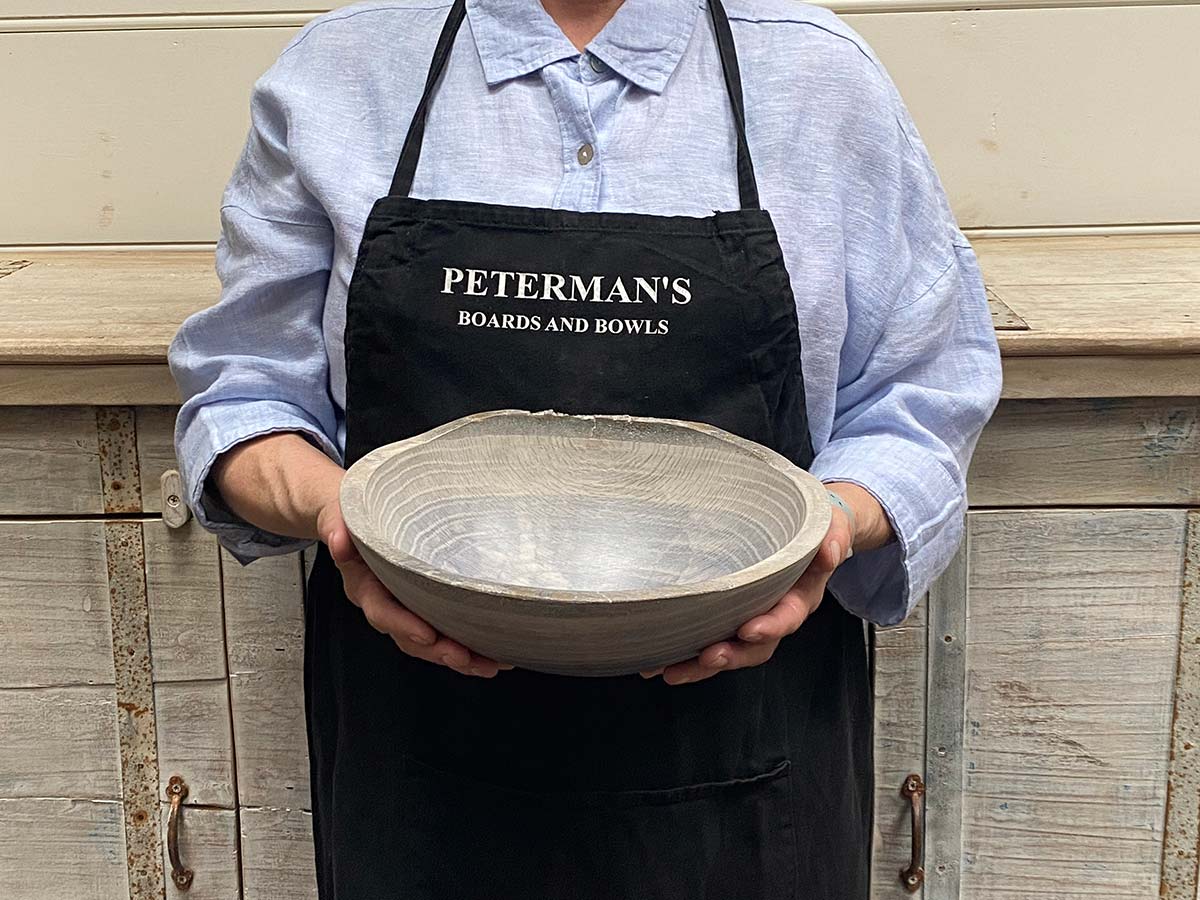 Small 10-inch driftwood oak oval, live edge wooden bowl, handcrafted with a natural live edge design.