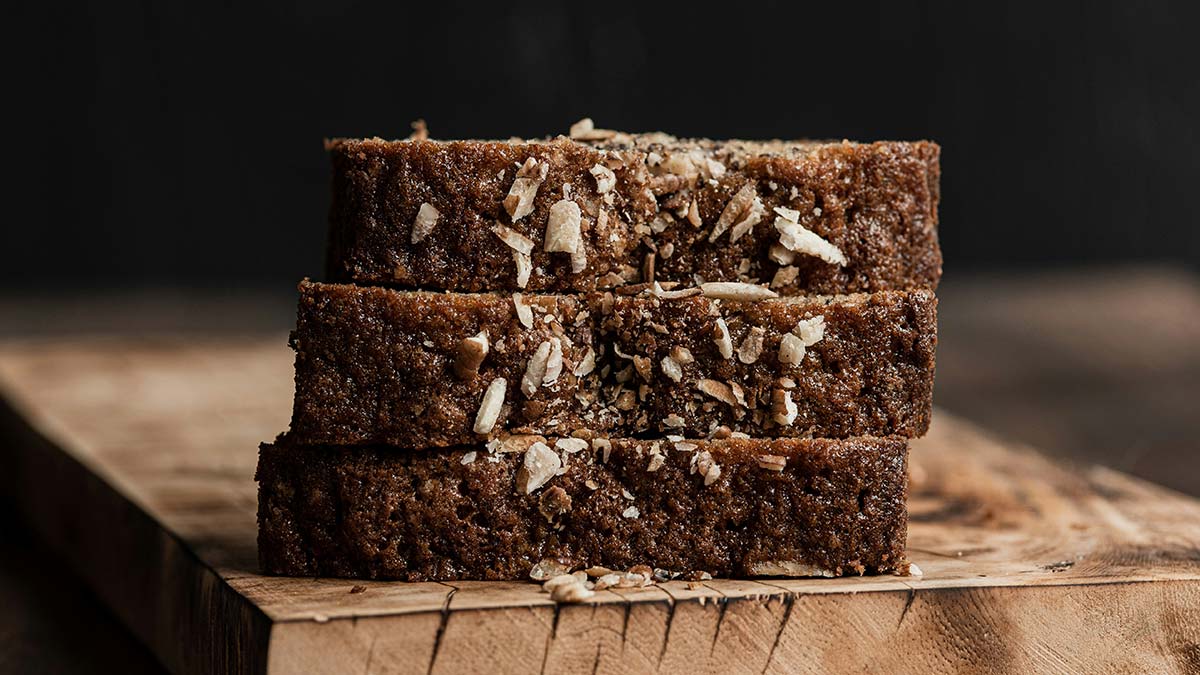 Slices of spiced cake stacked on a wooden board, sweet addition to charcuterie board ideas